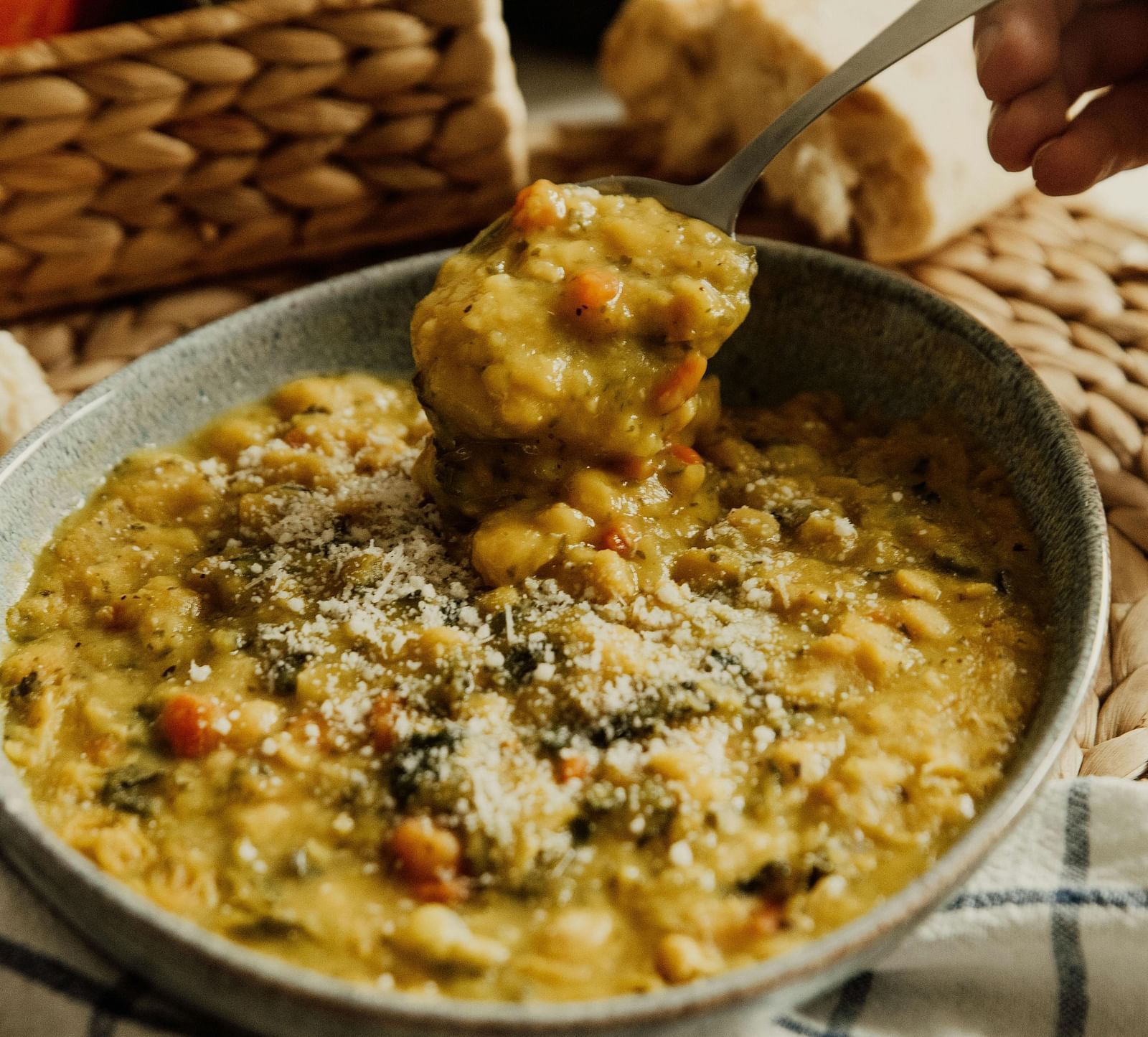AN image of a bowl where a lentil soup is served