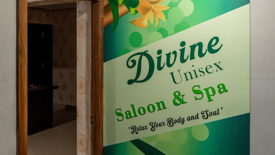 Entrance of Divine Salon and Spa with signage at Hotel Royal Regency Chennai