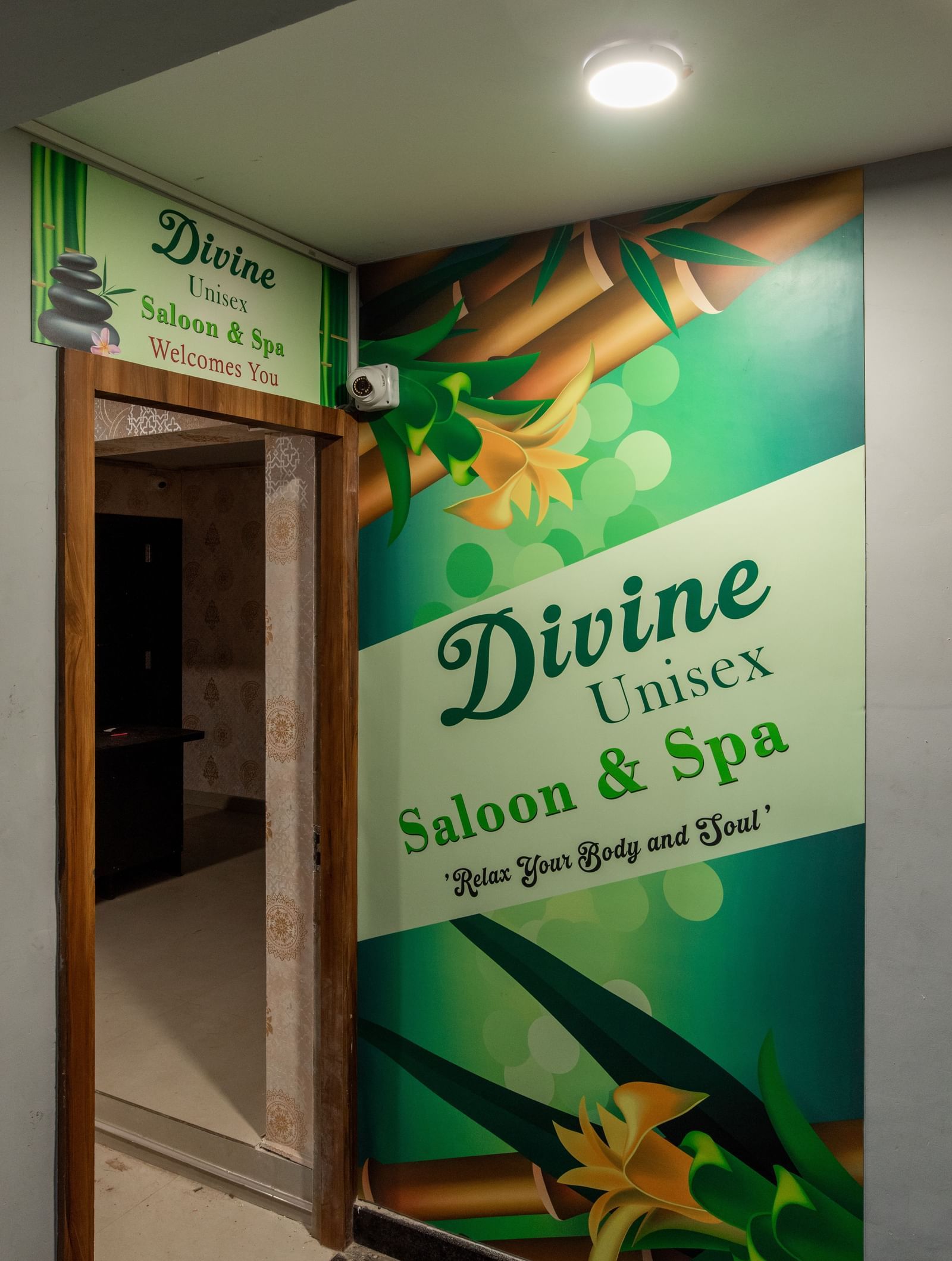 Entrance of Divine Salon and Spa with signage at Hotel Royal Regency Chennai