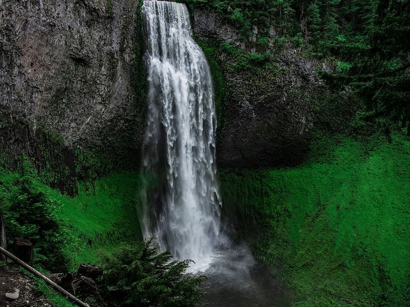 view of a waterfall cascading down rocks 1
