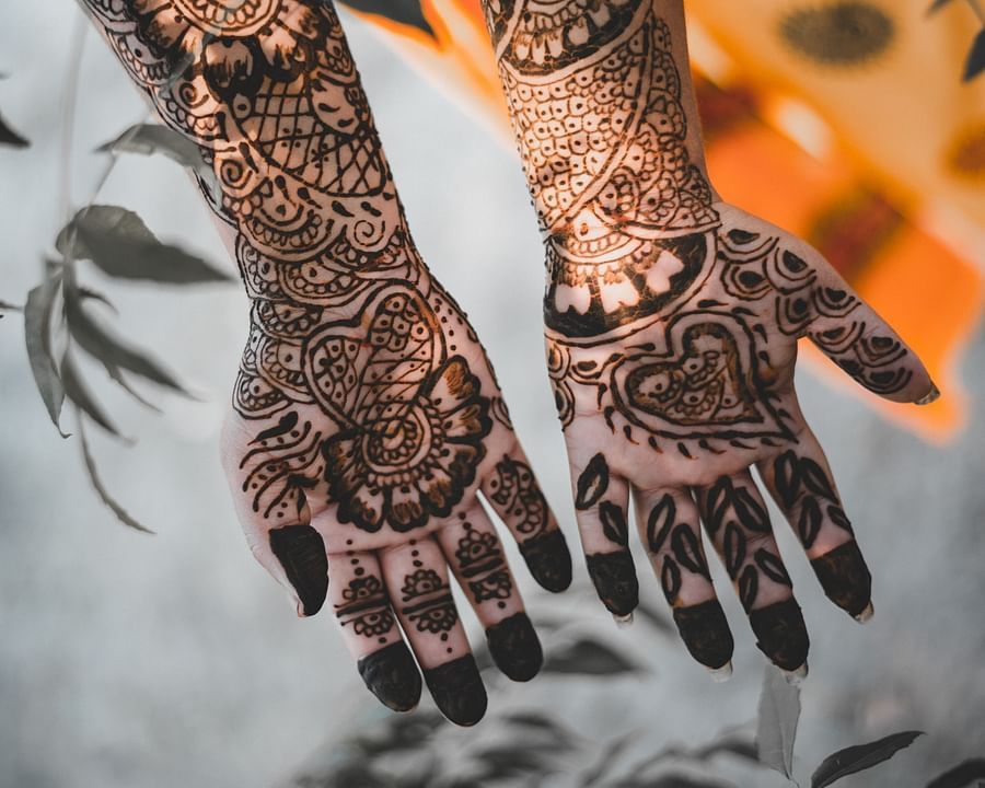 bride showing her henna covered hands