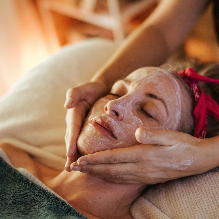 A woman getting massage done at a spa.