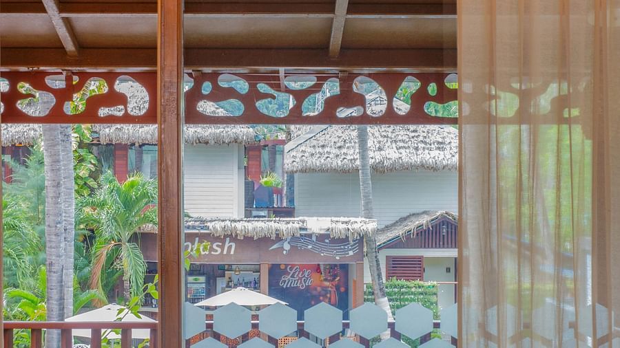 Image of Coral Turquoise at Coral Reef Resort and Spa in Havelock featuring the door to the balcony with seating space