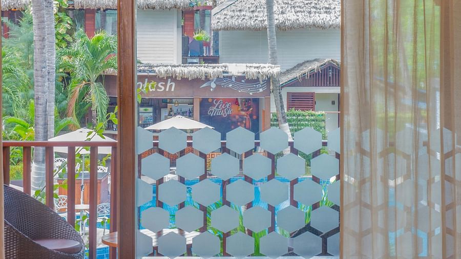 Image of Coral Turquoise at Coral Reef Resort and Spa in Havelock featuring the door to the balcony with seating space