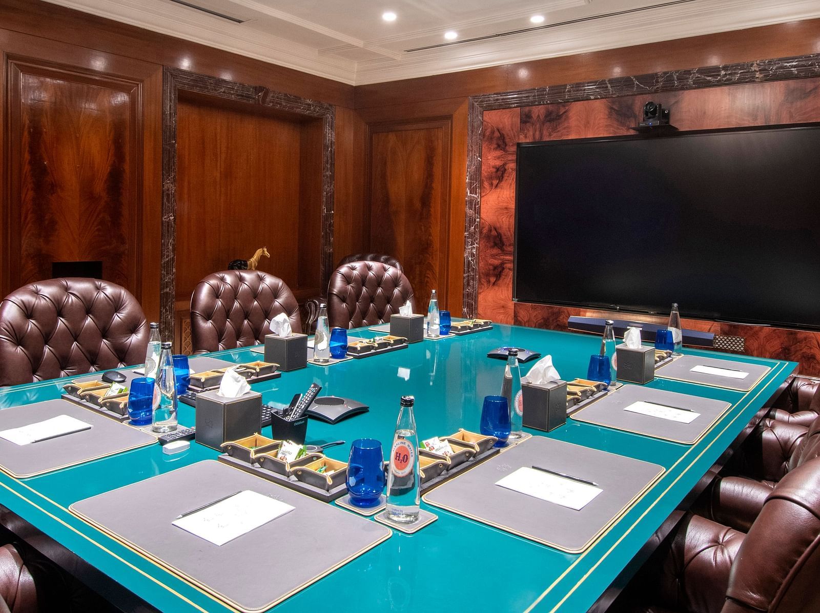 image of the senate board room with premium stationary laid down for the guests - The Claridges New Delhi