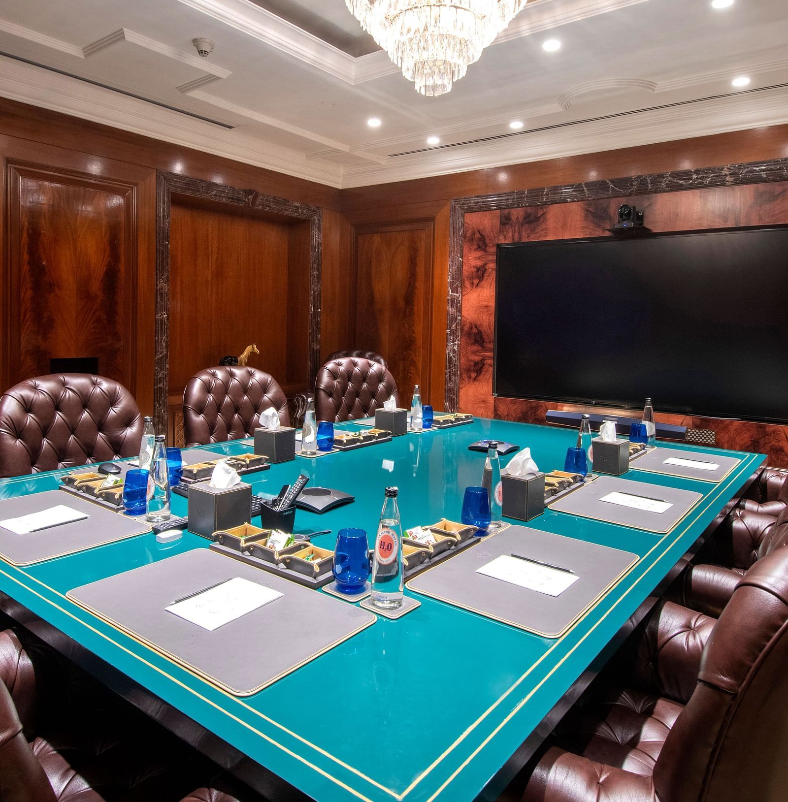 image of the senate board room with premium stationary laid down for the guests - The Claridges New Delhi