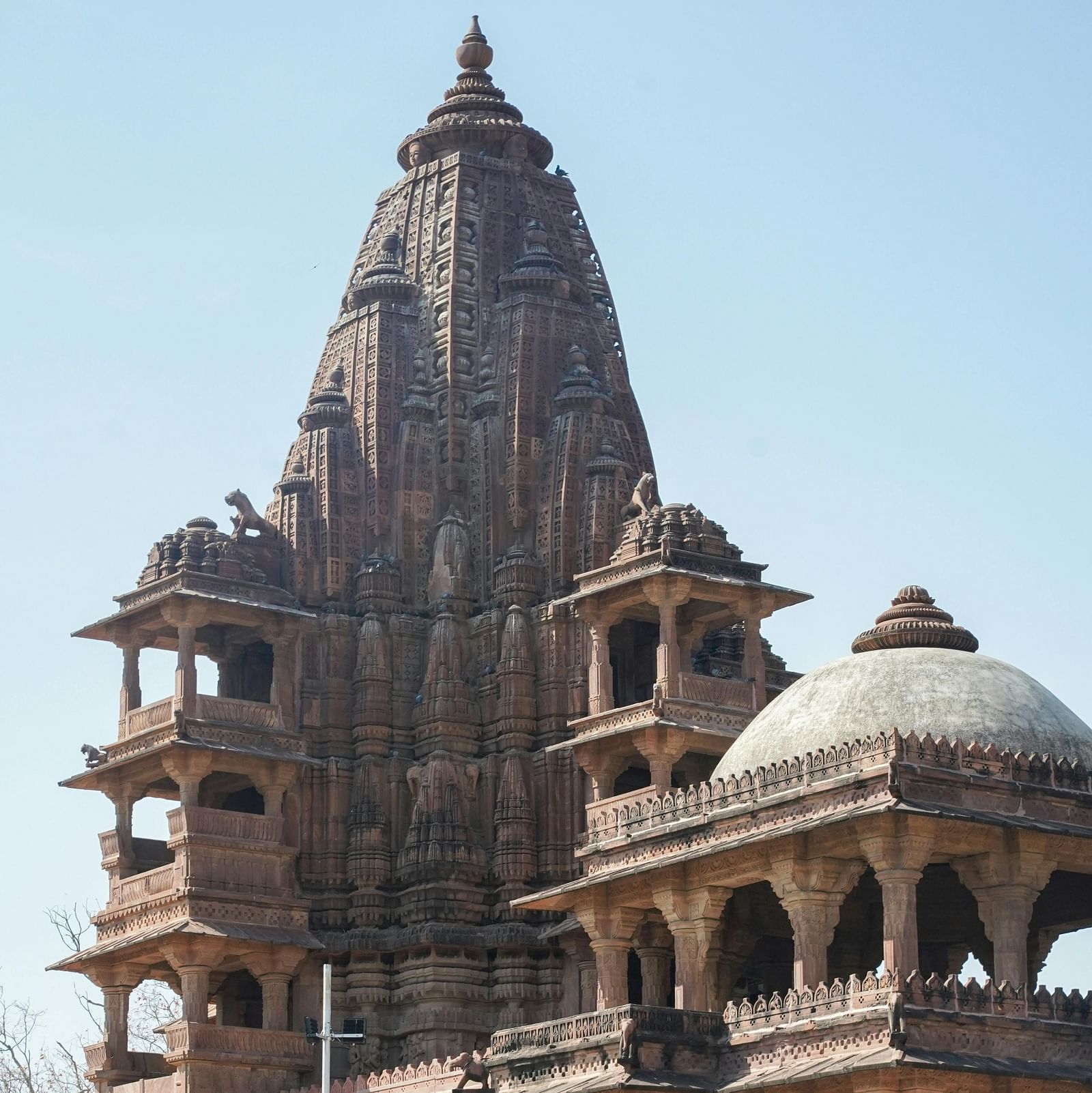 Facade of a structure at Mandore Gardens with a clear sky in the background.