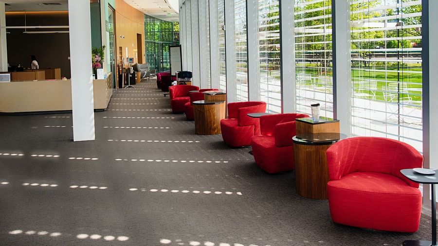 Seating besides large windows in a hotel lobby
