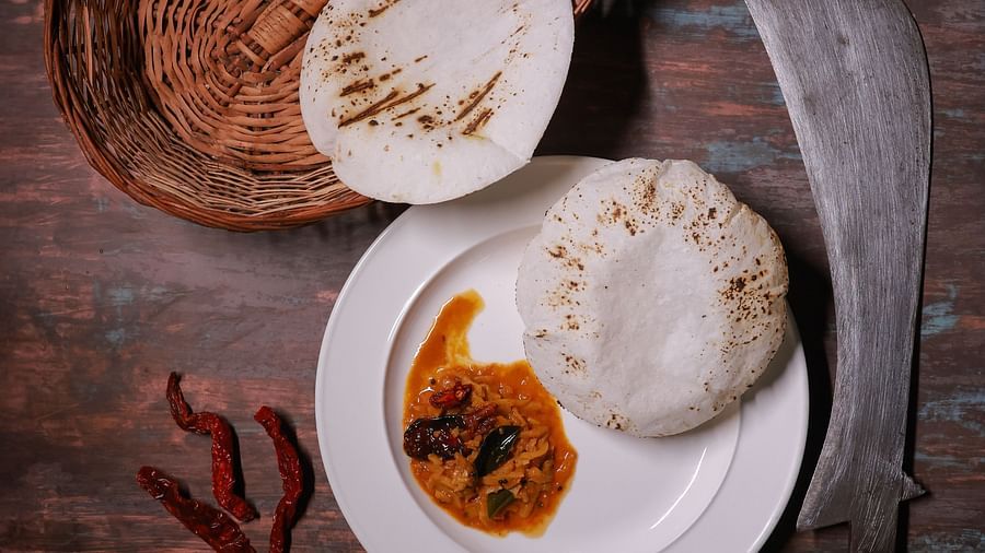 aerial view of Rice roti with curry at The canopy, Capitol Village Resort, Madikeri