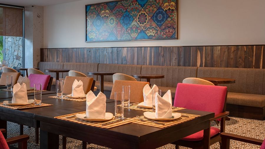 An image of a dining table and chairs - Alibu Resorts Nha Trang