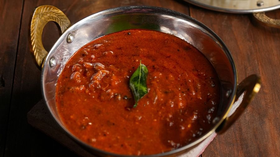 Image of Manathakkali Vatha Kuzhambu served with ghee rice at Hotel Aadithya, Chennai