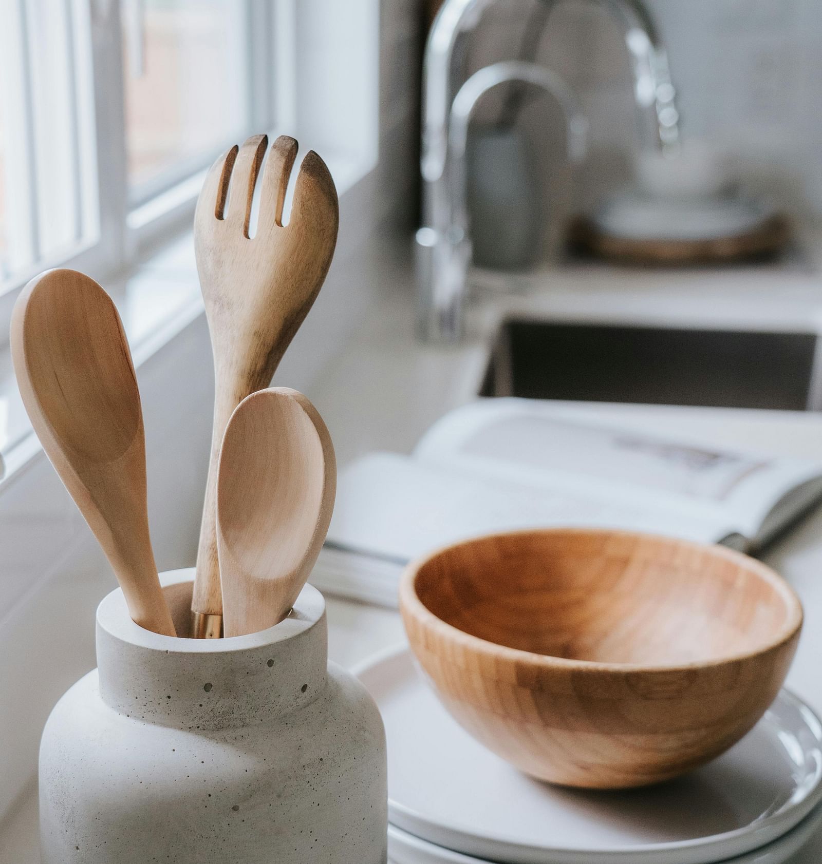 Wooden utensils placed on a kitchen counter
