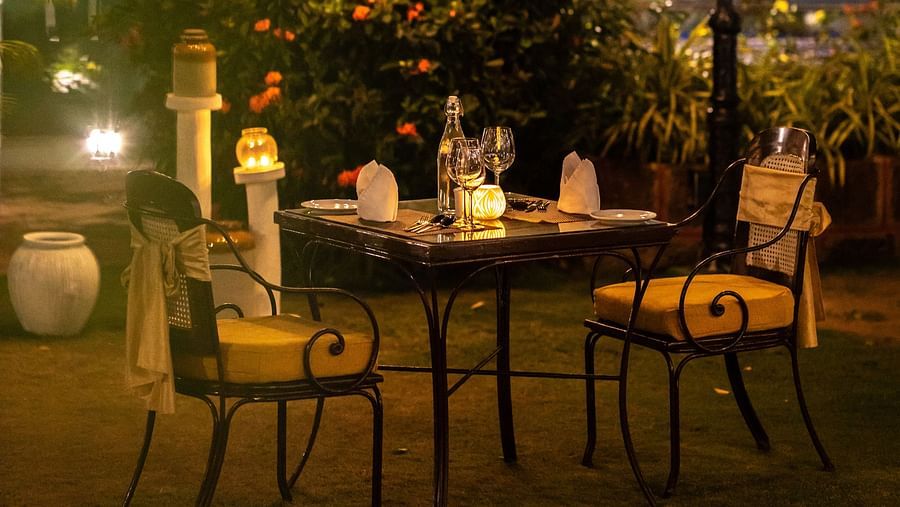 romantic dinner setup with lights and candles