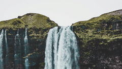 a waterfall cascading down a hill