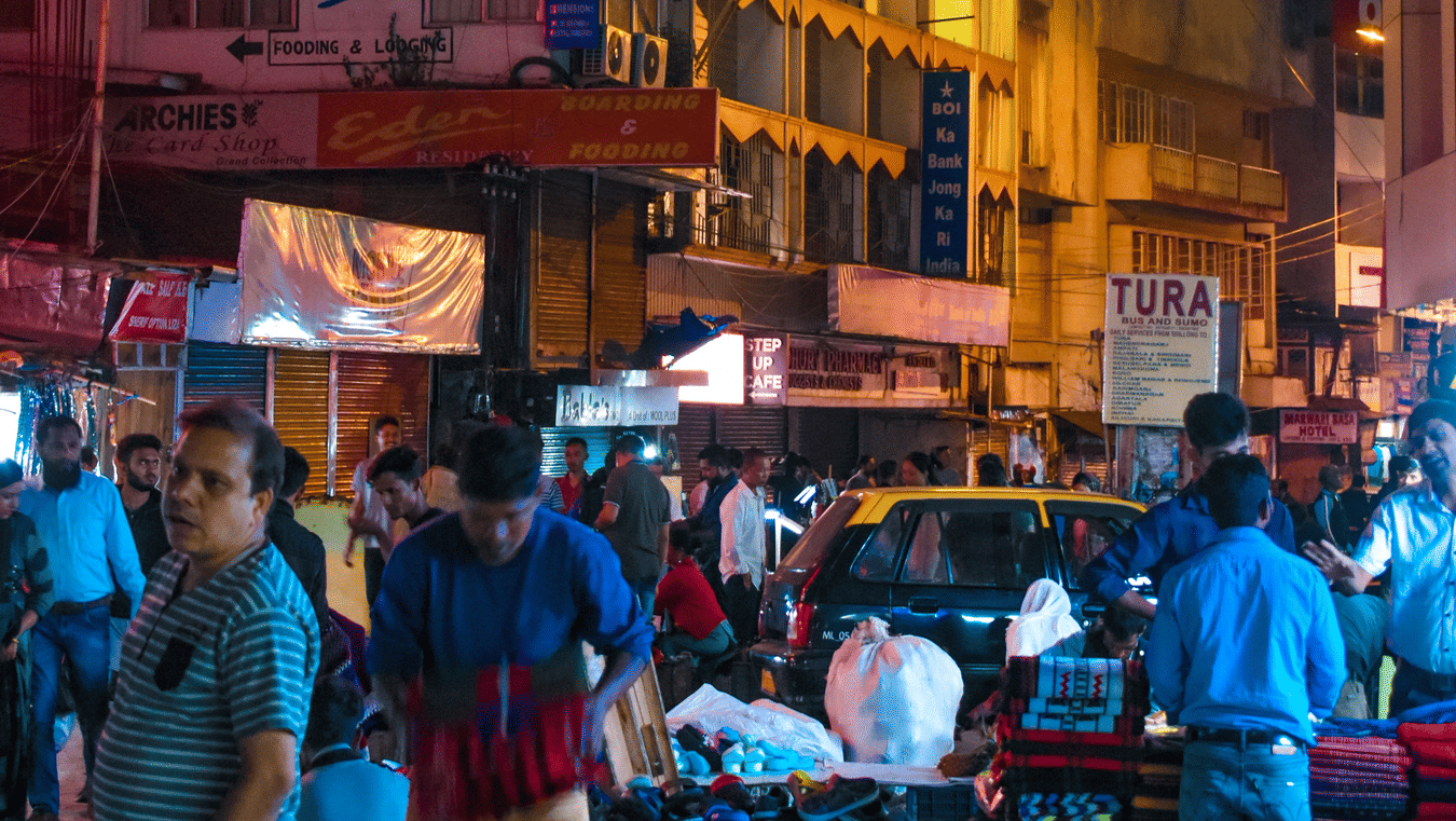 a busy street filled with cars and people