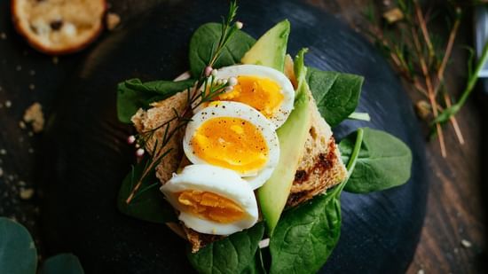 egg salad with three pieces of egg and leafy vegetables - Stone Wood Riverfront Resort, Siolim