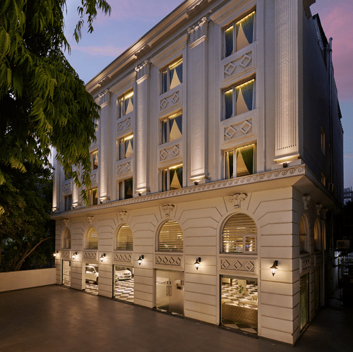 An image of the facade illuminated by ambient lighting - Deventure Sarovar Portico, Patel Nagar