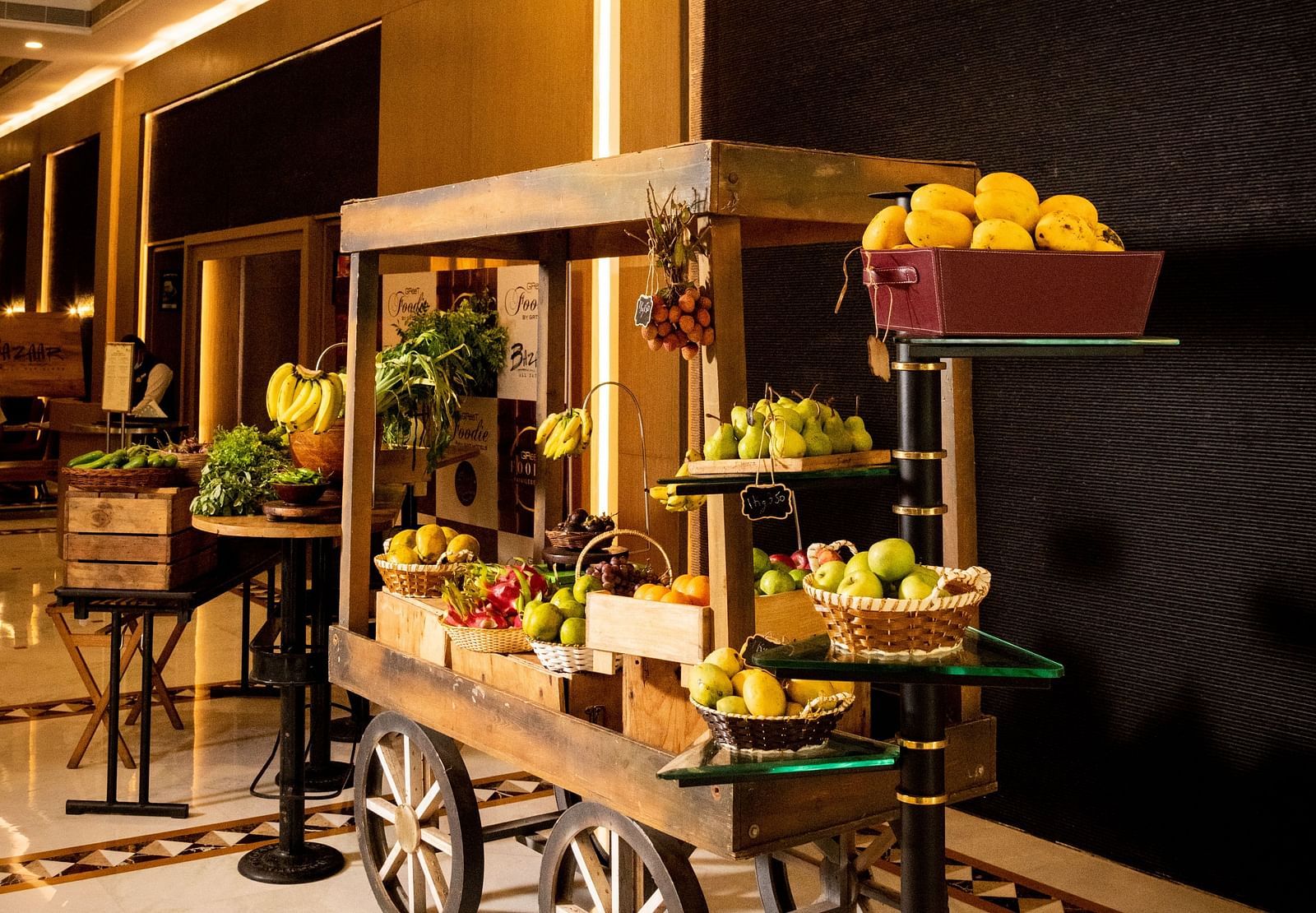 A cart with fruits at Grand Chennai By GRT Hotels.