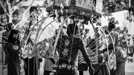 A devotee carrying a decorated kavadi during a Thaipusam procession, symbolising faith, discipline, and devotion.