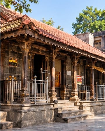 Chavadi, a tiled-roof hall with carved wooden pillars
