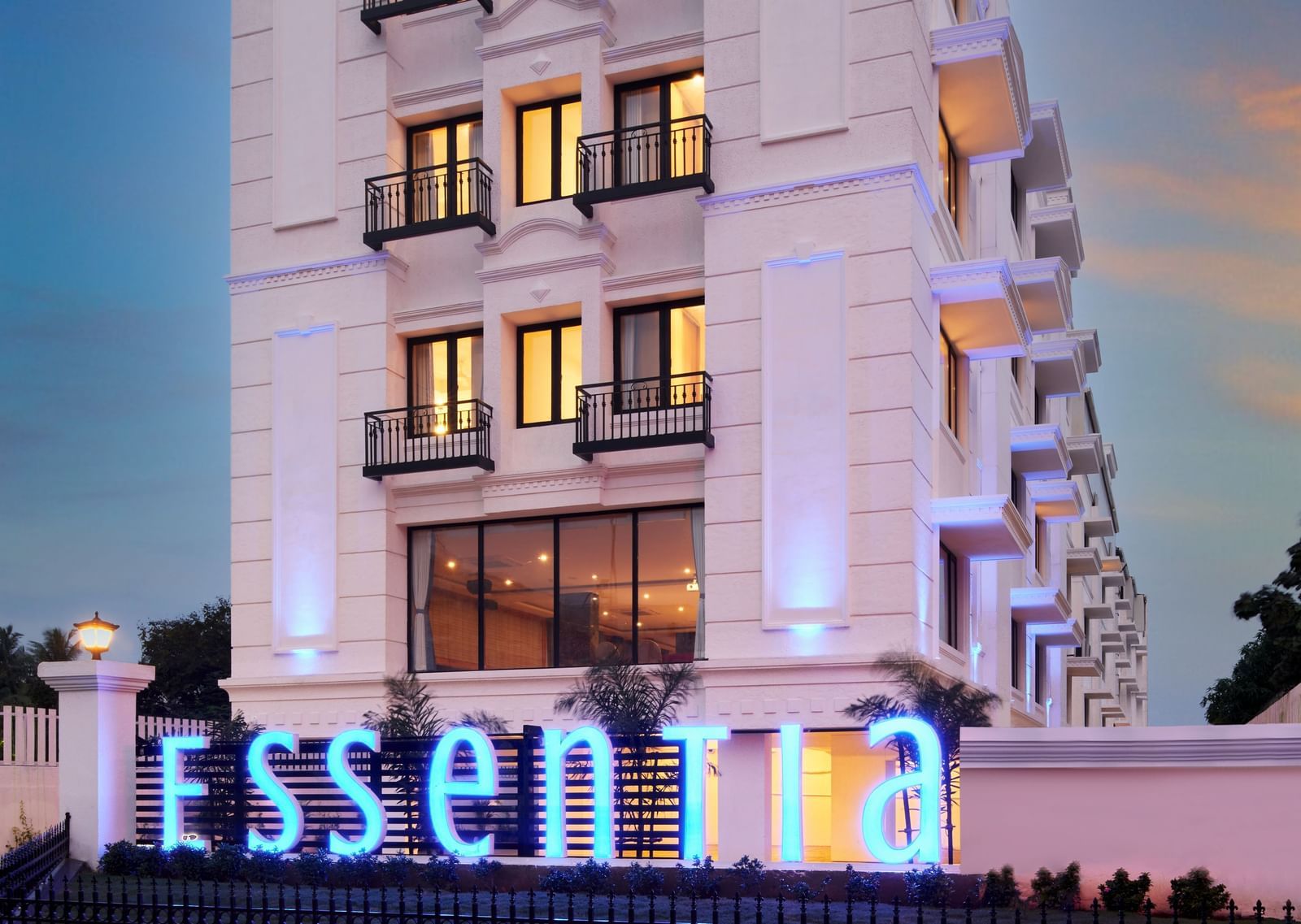An overview of the Facade of Essentia Premier Hotel, Chennai during twilight.