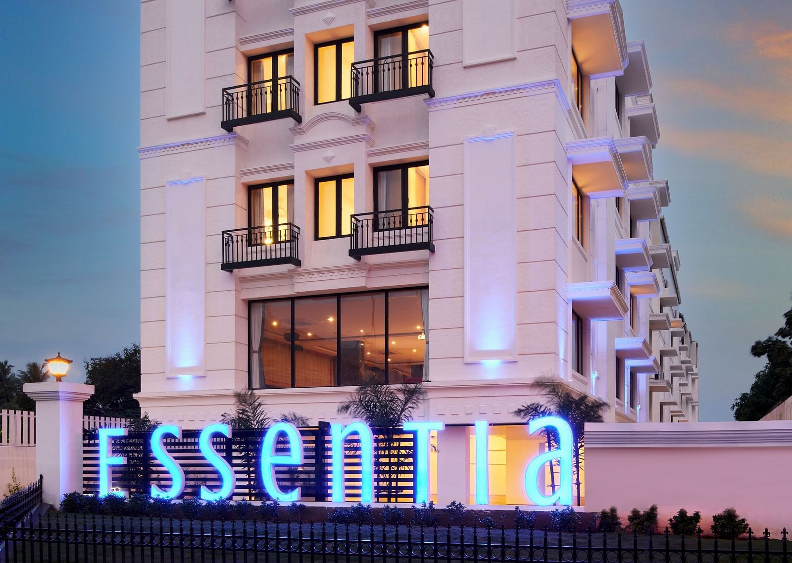 An overview of the Facade of Essentia Premier Hotel, Chennai during twilight.
