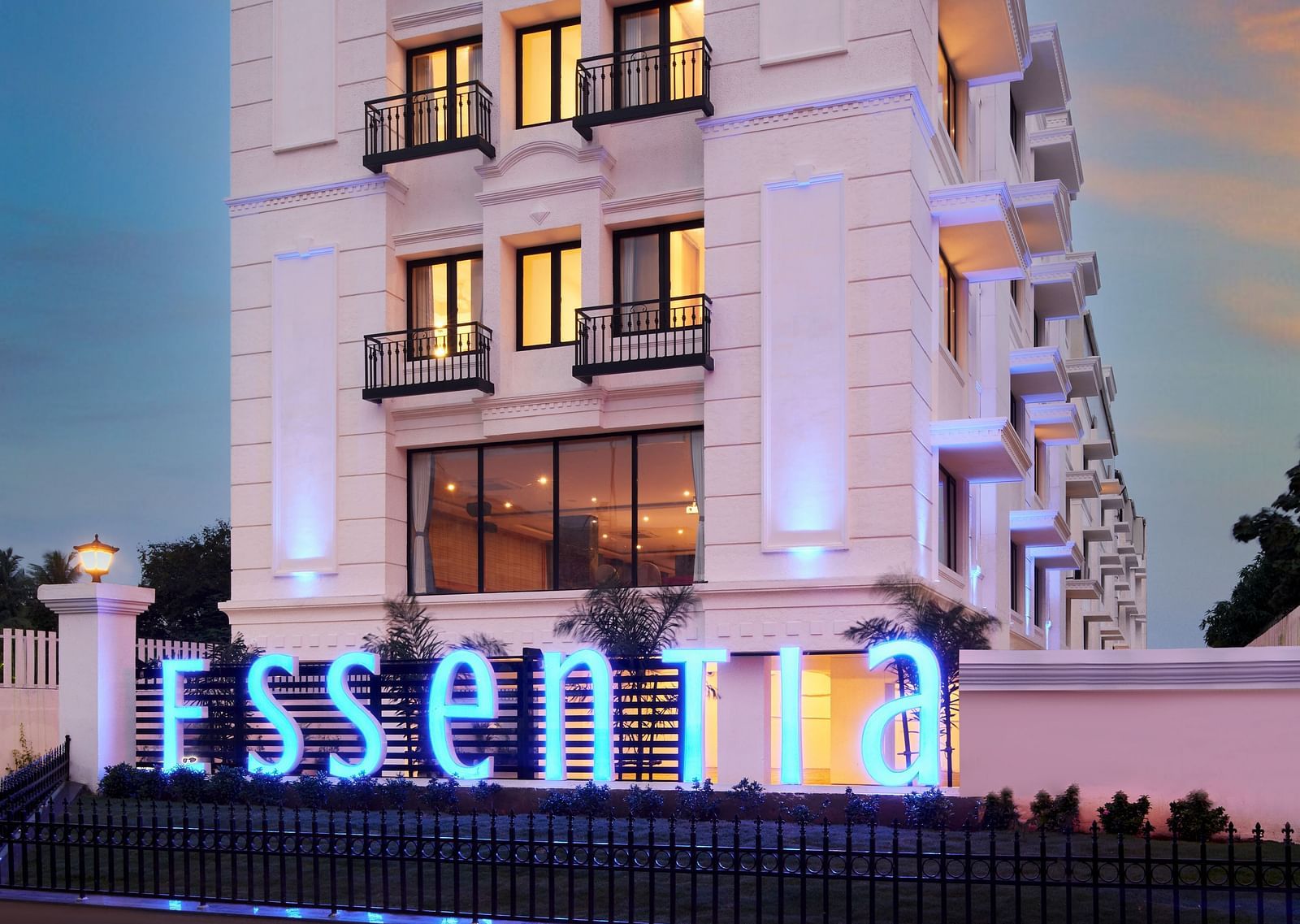 An overview of the Facade of Essentia Premier Hotel, Chennai during twilight.