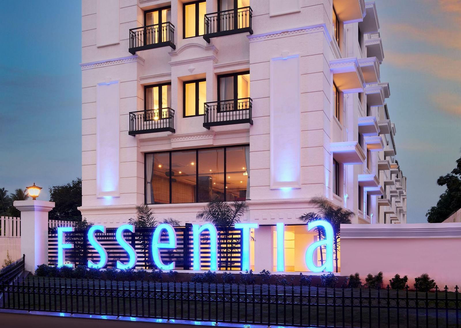 An overview of the Facade of Essentia Premier Hotel, Chennai during twilight.