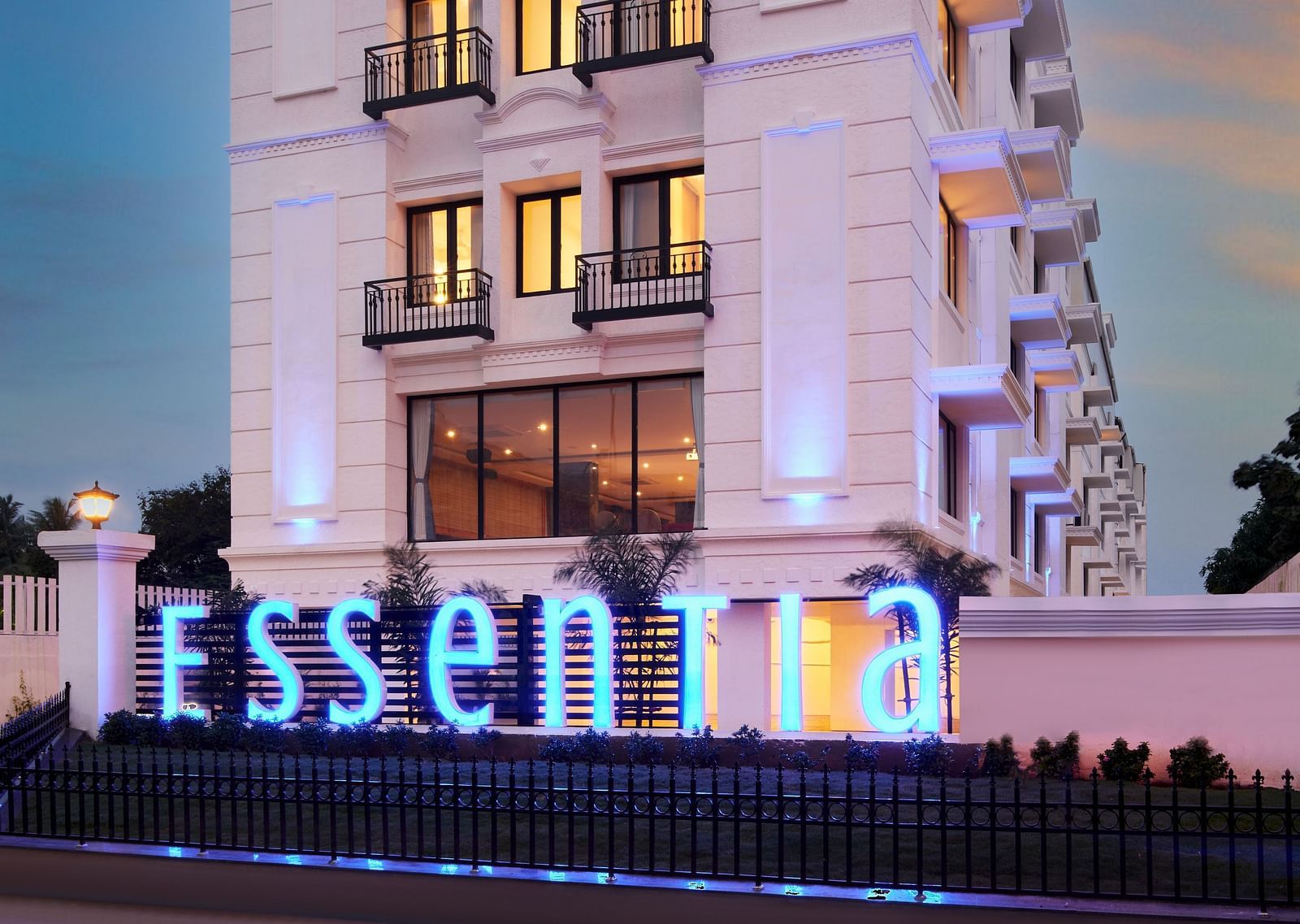 An overview of the Facade of Essentia Premier Hotel, Chennai during twilight.