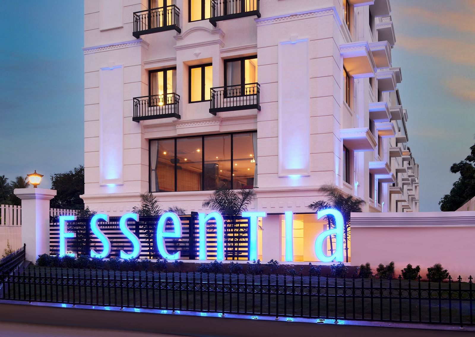 An overview of the Facade of Essentia Premier Hotel, Chennai during twilight.
