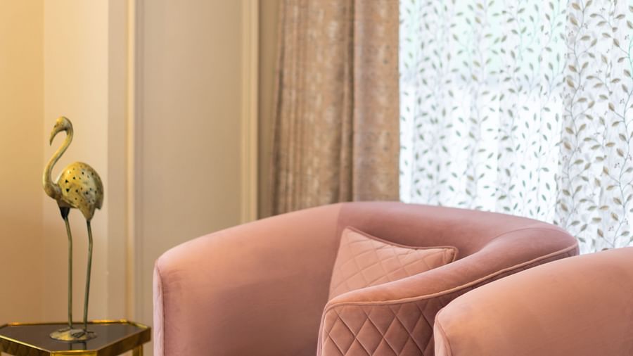 2 pink sofa chairs in the lobby | Renest Calangute, Goa