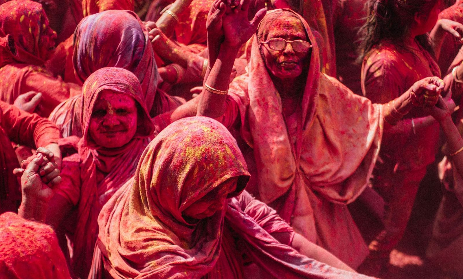 People playing Holi and covered in colours