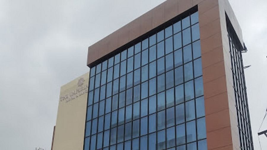 The facade of Yashshree The Imperial Inn, Siliguri displayed in a full shot with a cloudy sky