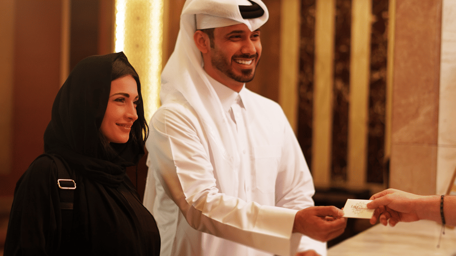 Guests checking in at the reception desk of La Maison Hotel, Doha.