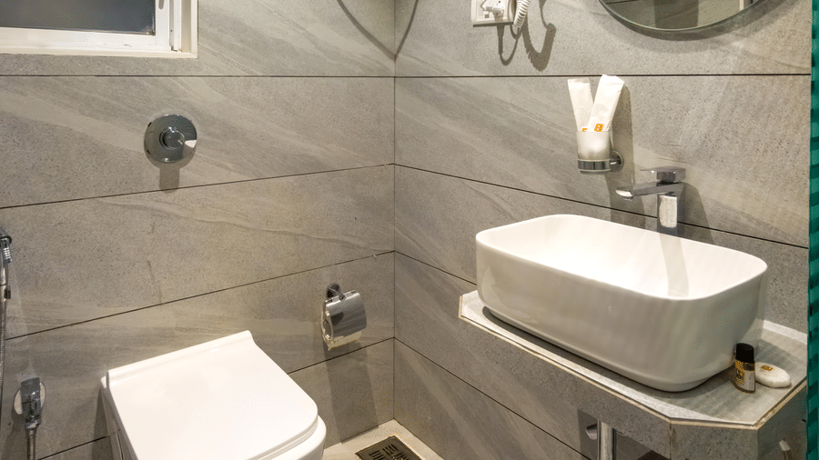 Contemporary bathroom with premium amenities at Home2 Residency, Mumbai Airport