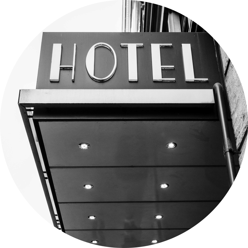A classic hotel signboard marking the entrance to the property.