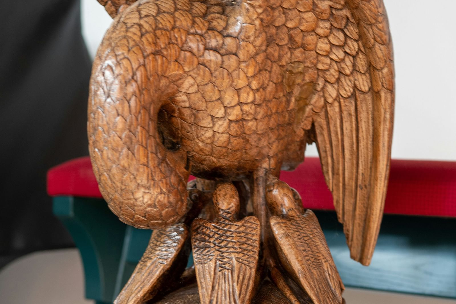 an image of a wooden finished bird placed on the table