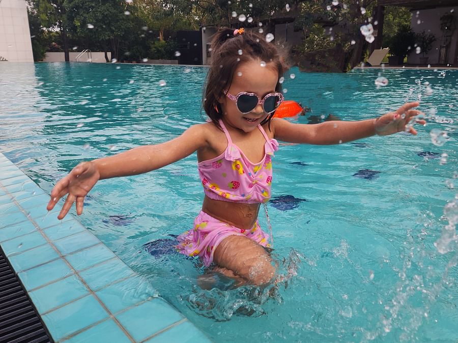 Child having fun in a swimming pool.