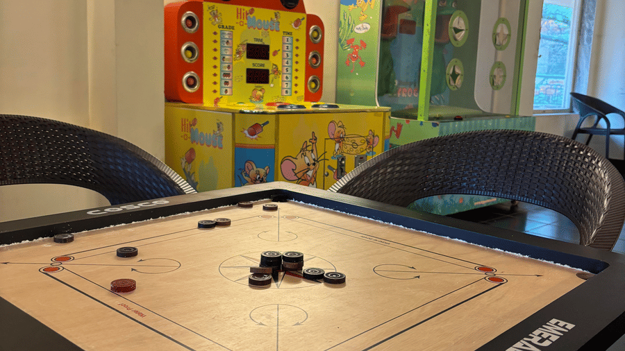 A carrom table at the indoor game room of the hotel.