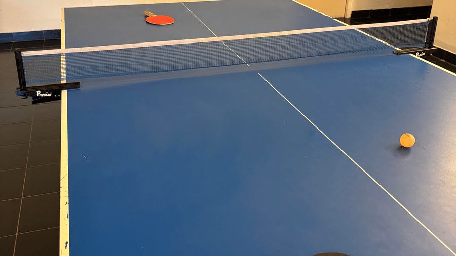 A table tennis setup in the indoor gaming room of the hotel.