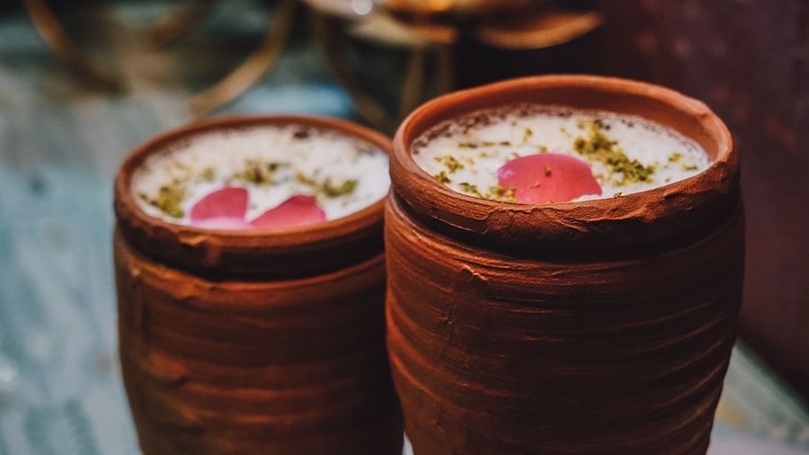 Lassi being served in earthen glasses