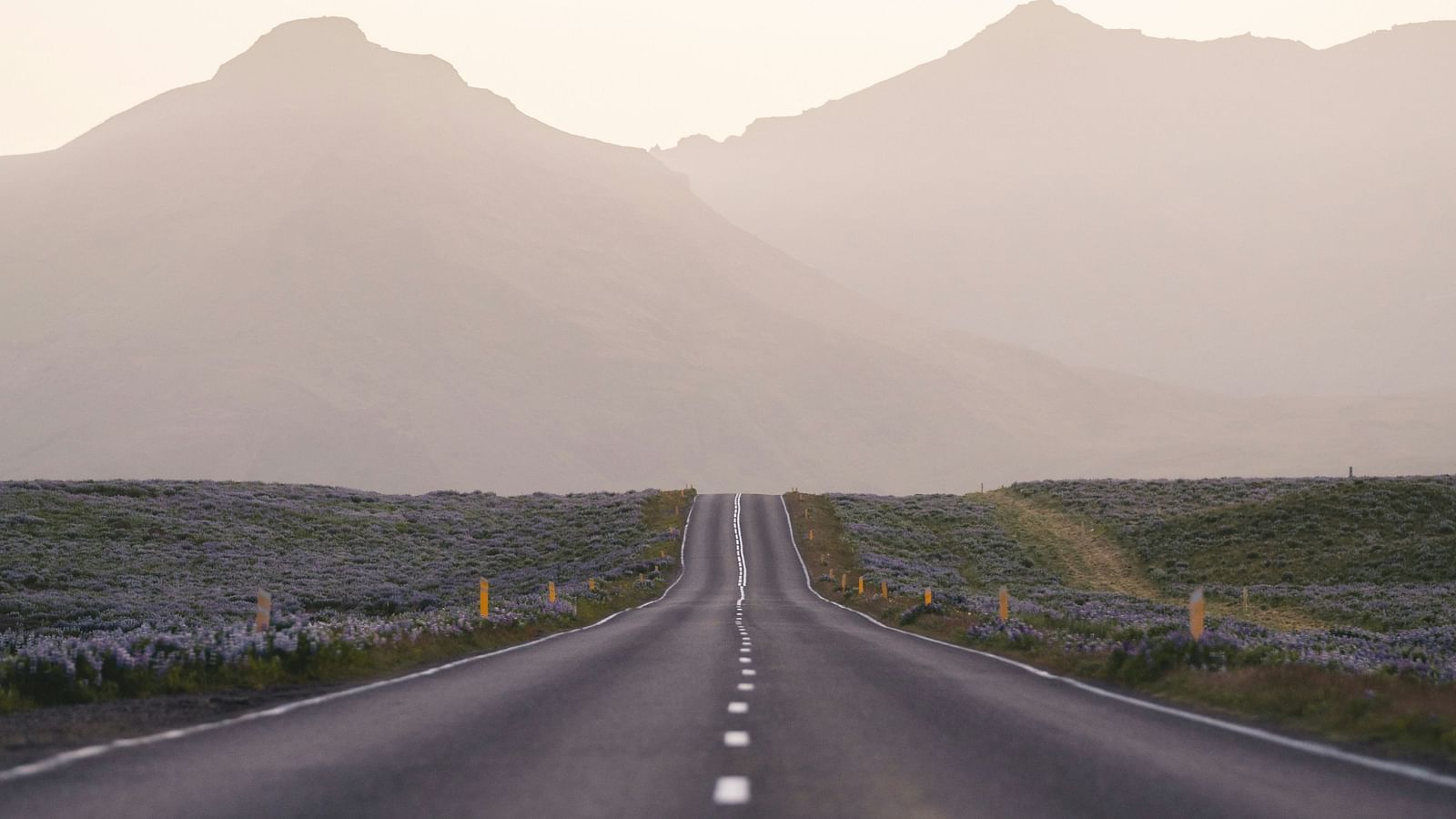 An overview of an empty highway with hills in the distance.