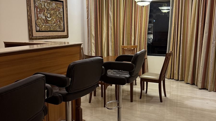 A wooden table with high chairs placed beside it | Cenneys Gateway
