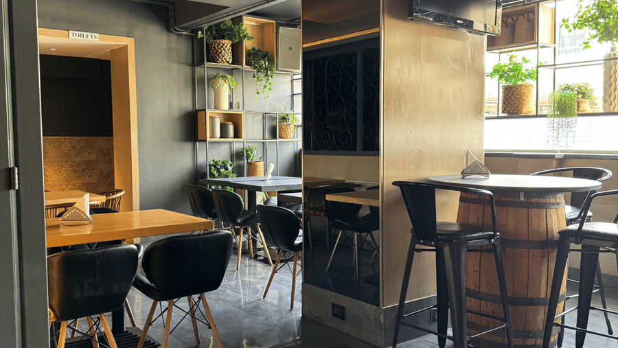 A cosy dining area with tables and chairs, showing a relaxed atmosphere at Cenneys Gateway.