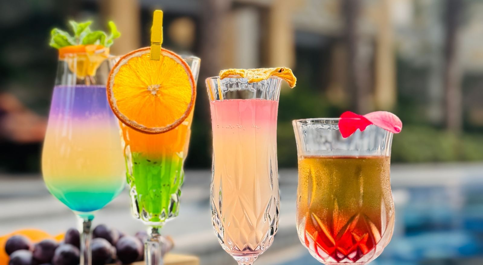 A dreamy array of cocktails with a palace view in the background - Kaldan Samudra Palace