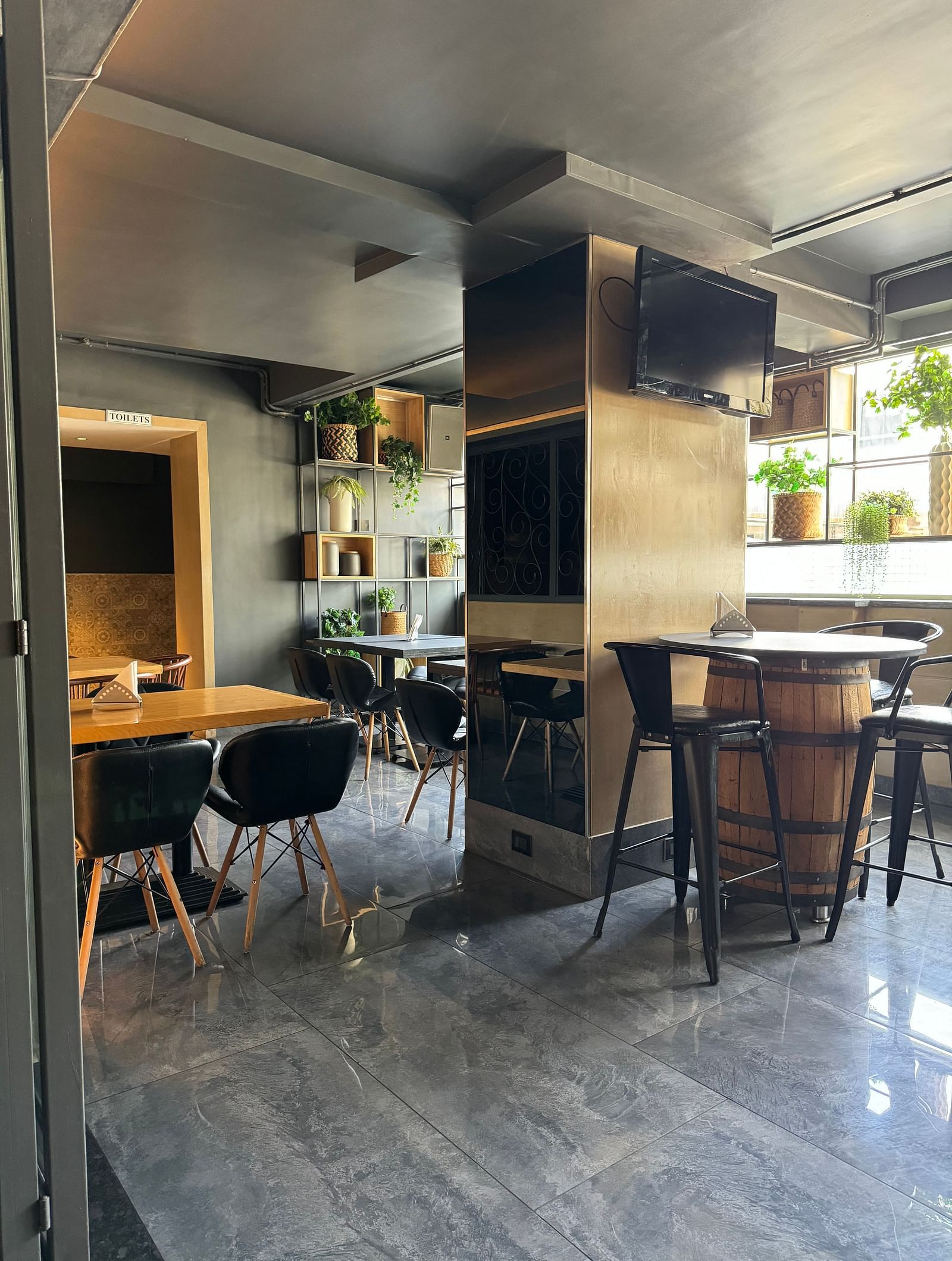 Dining area with tables and chairs, showing a relaxed atmosphere at Cenneys Gateway.
