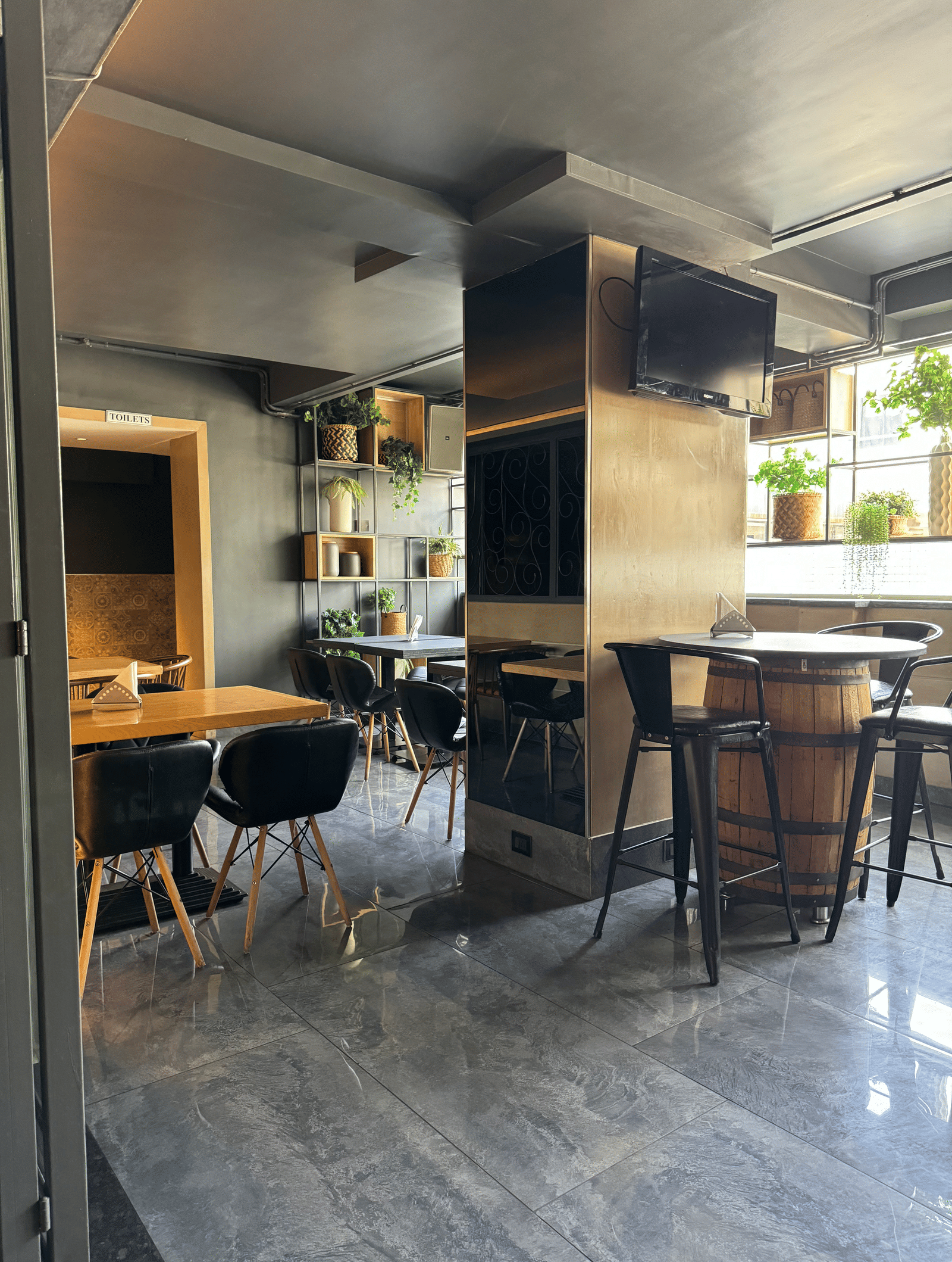 A cosy dining area with tables and chairs, showing a relaxed atmosphere at Cenneys Gateway.