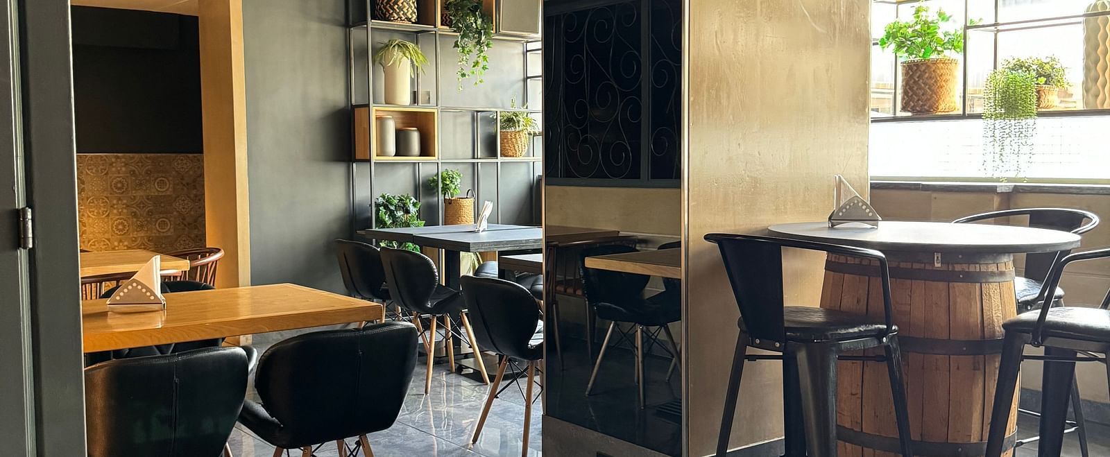 Dining area with tables and chairs, showing a relaxed atmosphere at Cenneys Gateway.