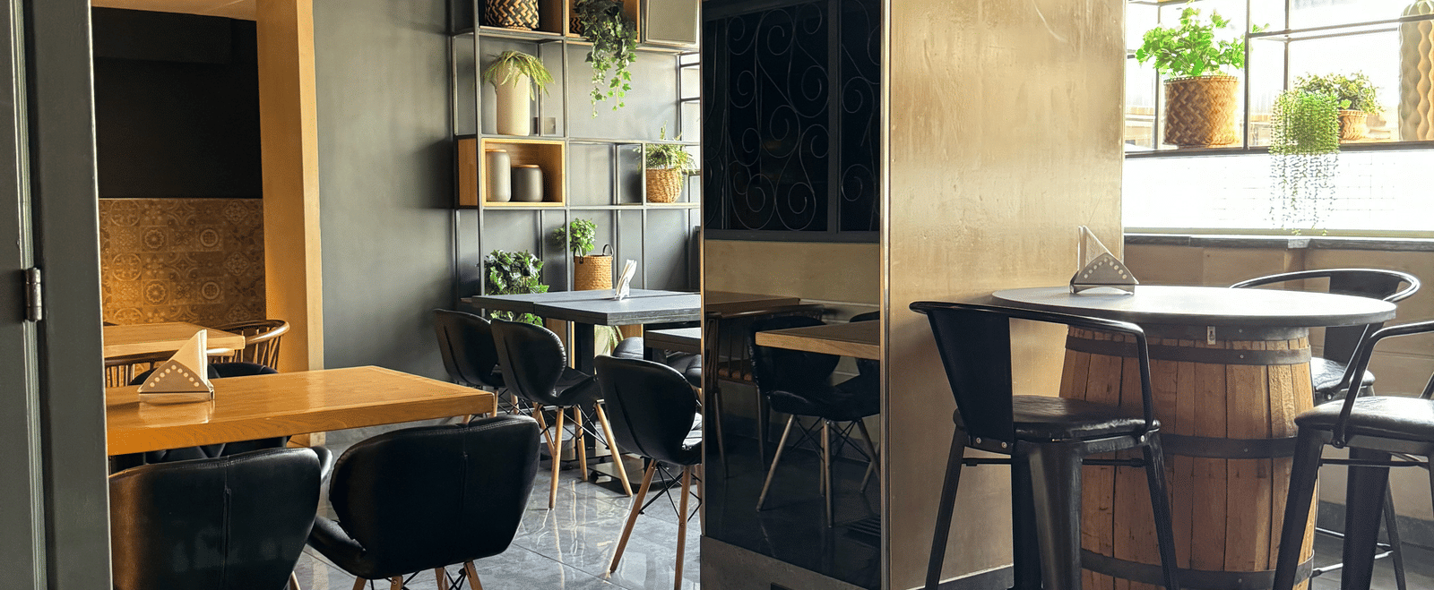 A cosy dining area with tables and chairs, showing a relaxed atmosphere at Cenneys Gateway.