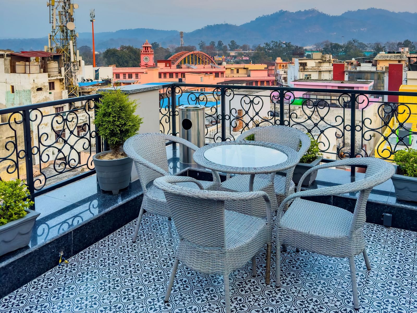 Another angle of serene views of Haridwar seen from the roof top restaurant with a round table in fore front - Wonder hills